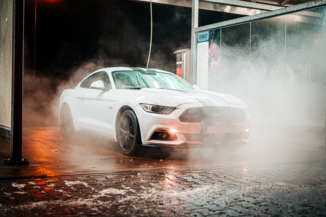 Image of washing the white Ford Mustang in a car wash for sale in Canada