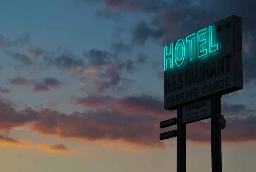 Image of a hotel sign at a hotel for sale in Canada