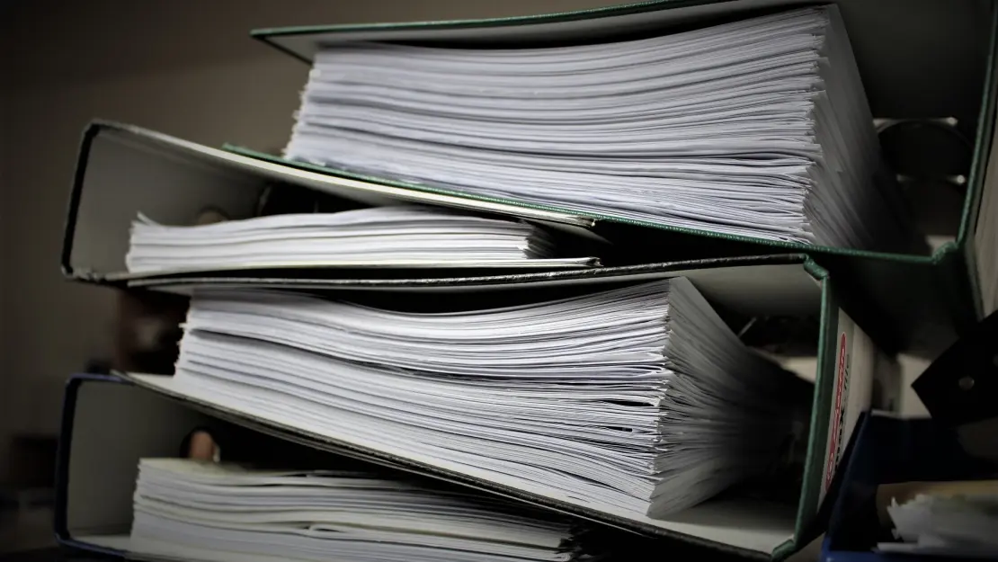 Image of piles of paperwork for selling a business