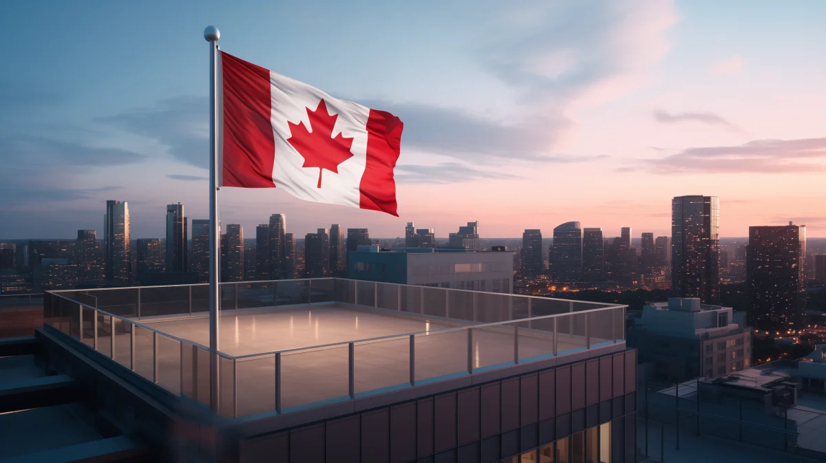 A rooftop view of a high rise with a waving Canadian flag showcasing opportunities to buy a business in Canada for foreign entrepreneurs.