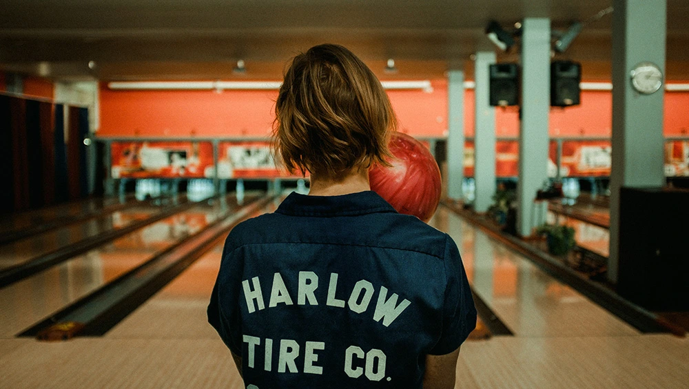 Image of a woman bowling at a bowling alley for sale in Canada