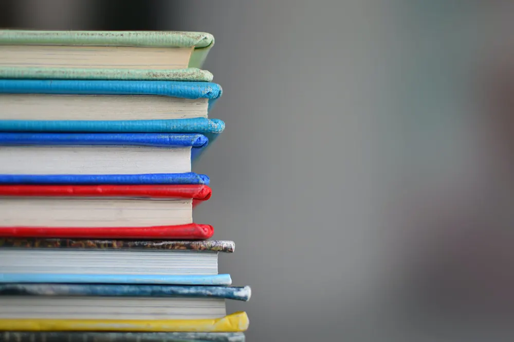 Image of a stack of books at an education business for sale in Canada