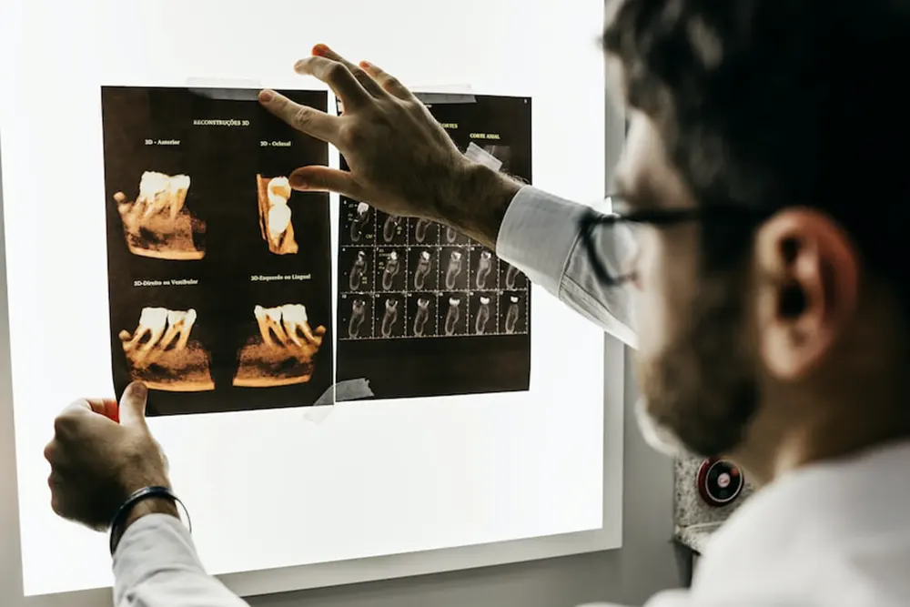 Image of a doctor examining an X-ray at a health clinic for sale in Canada