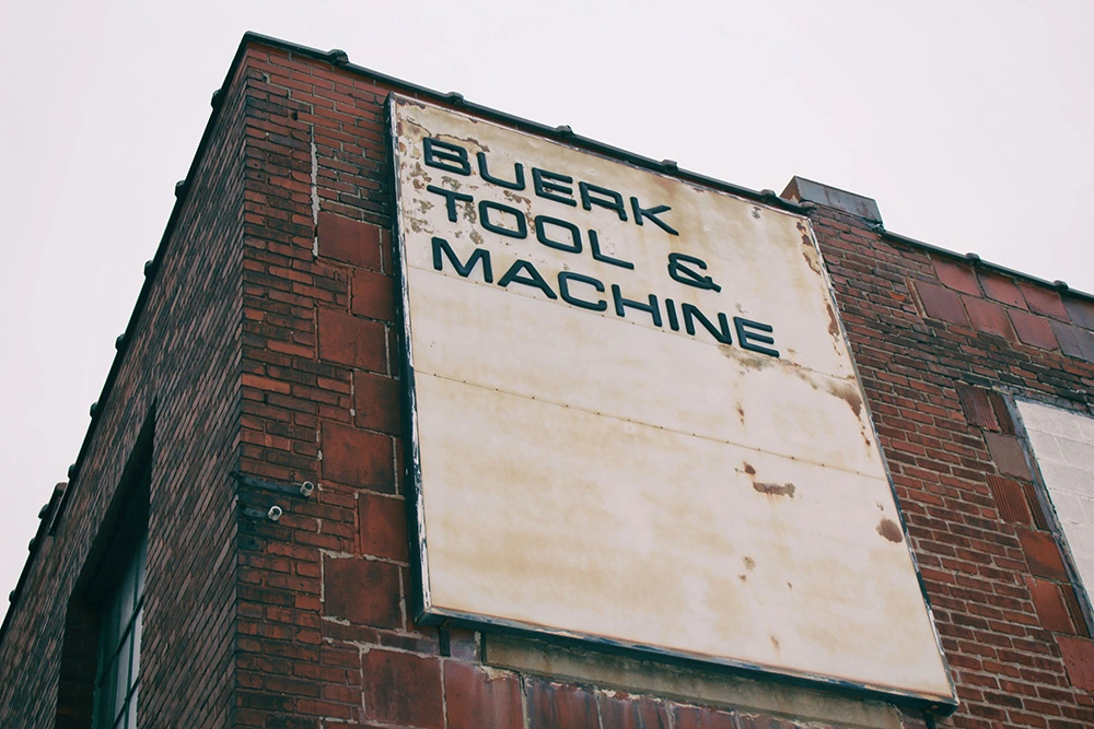 Image of a sign in front of a machine shop for sale in Canada