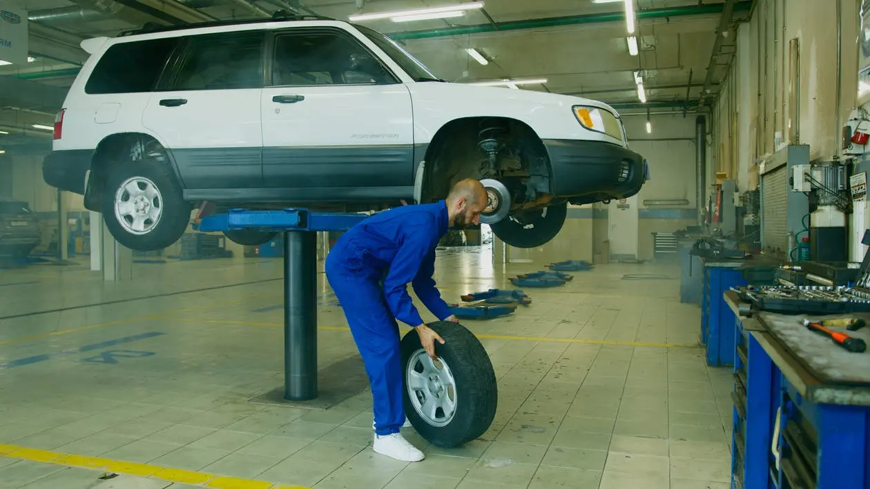 Image of a mechanic replacing a tire in a tire shop for sale in Canada