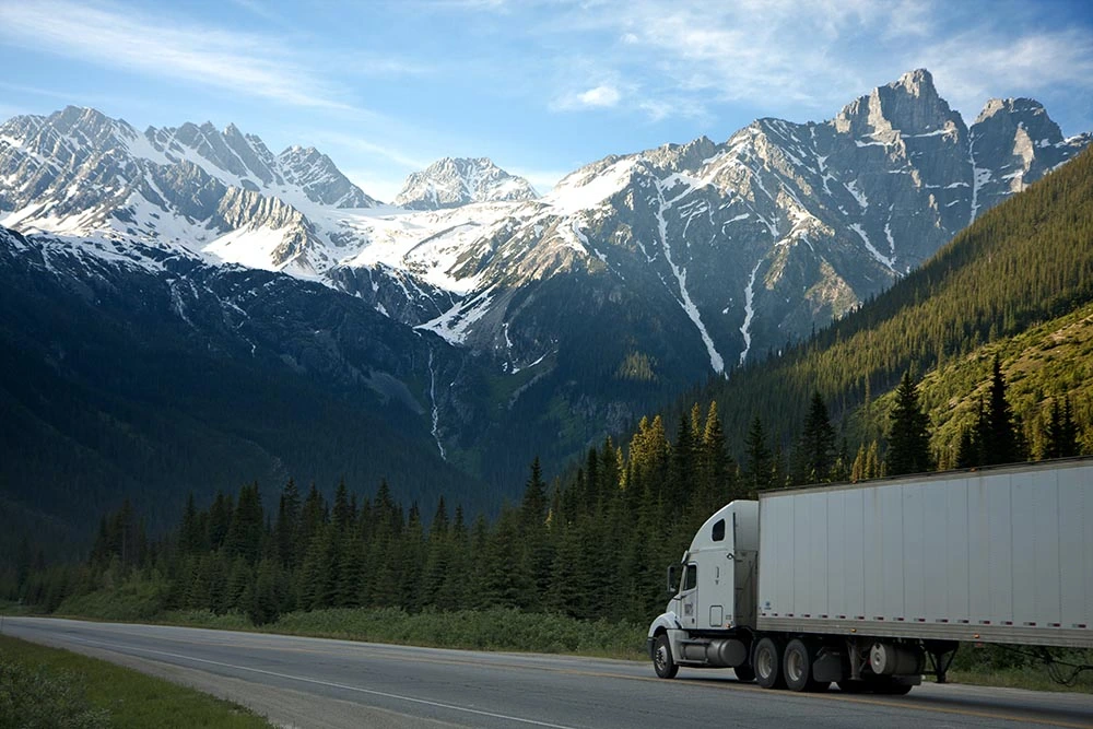 Image of a truck transporting goods from a trucking company for sale in Canada