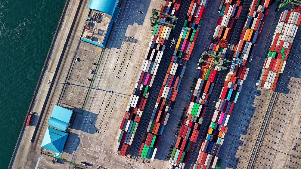 Image of shipping containers at a port near a trucking company for sale in Canada