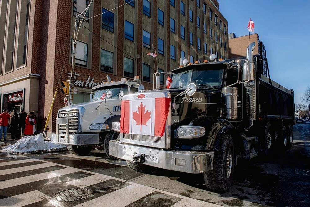Image of two trucks belonging to a wholesale business for sale in Canada